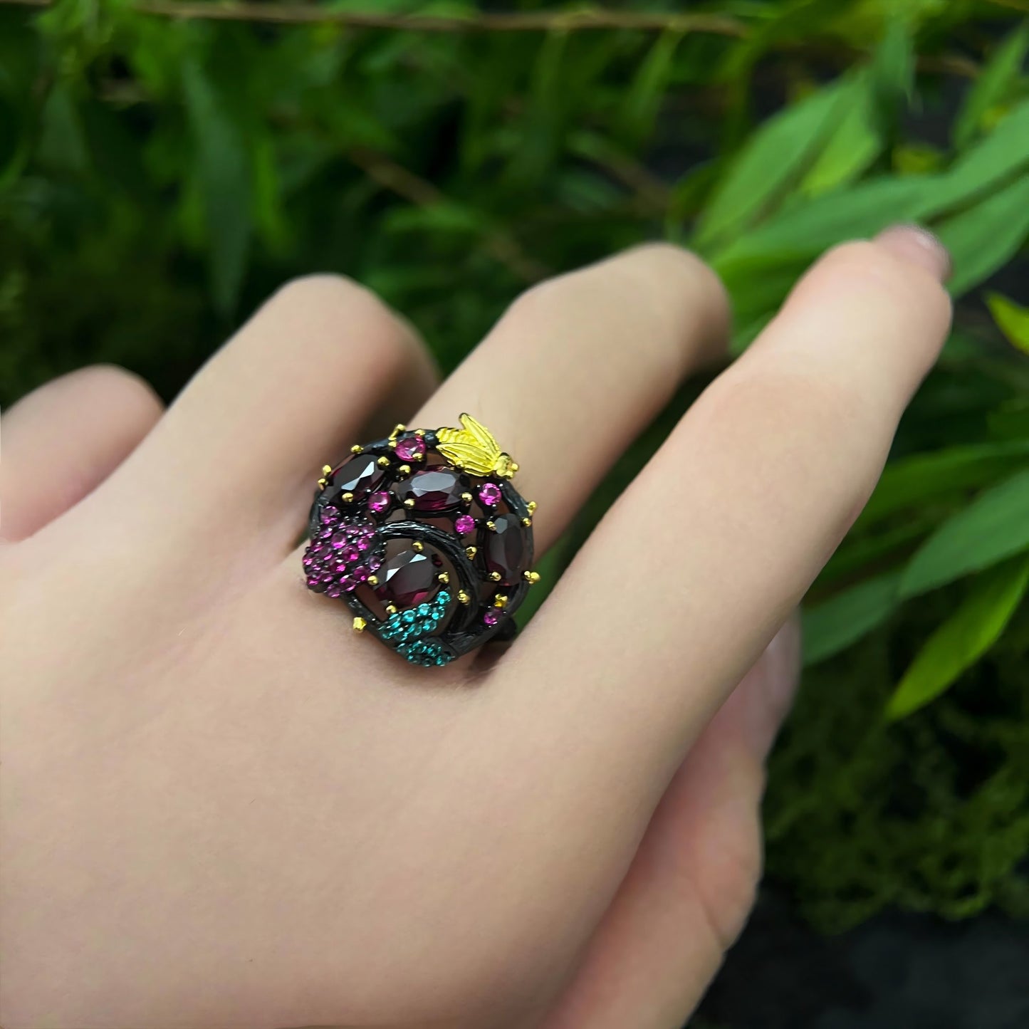 Bee & Bloom: Garnet Garden Cocktail Ring in Black Gold - Plated Silver