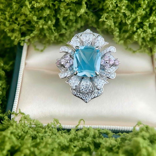 Blossom Sky: Blue Topaz and Pink Flower Ring in 925 Sterling Silver - Sound of Flowers