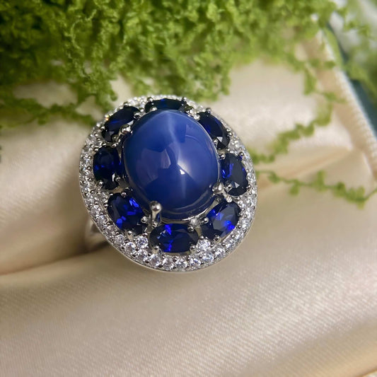 Blue Flame: Oval Cabochon Sapphire Ring with Dark Blue CZ - Sound of Flowers