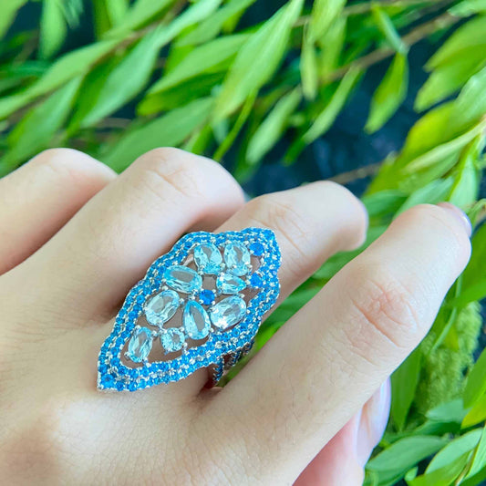 Water Ripple: 9 Stone Sky Blue Topaz Ring in 925 Sterling Silver - Sound of Flowers