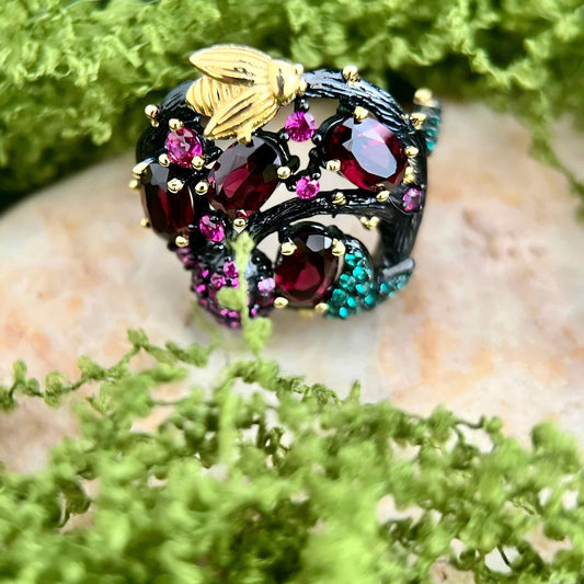 Bee & Bloom: Garnet Garden Cocktail Ring in Black Gold - Plated Silver