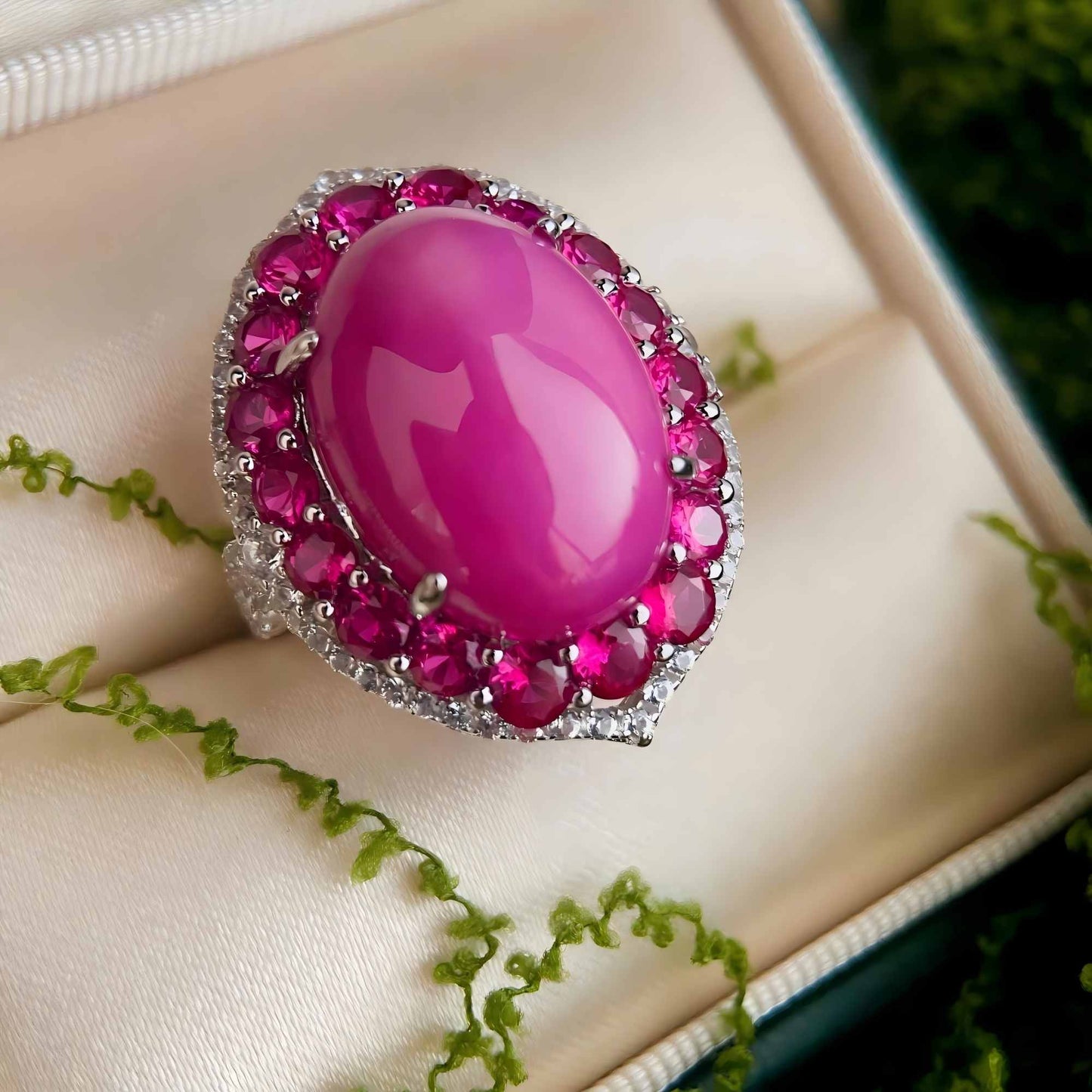 Twilight Flame: Oval Cabochon Lab-Grown Ruby Ring with Pink CZ Halo