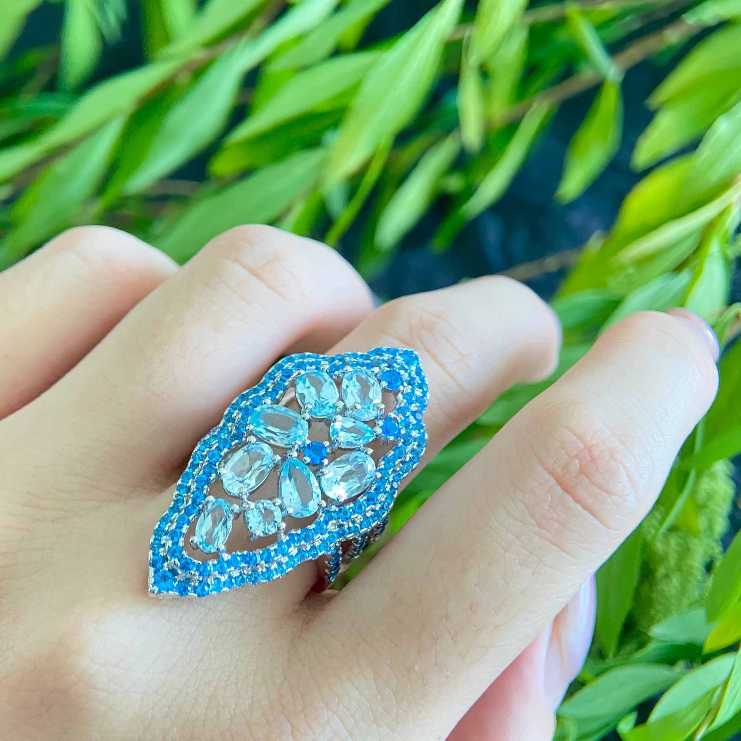 Water Ripple: 9 Stone Sky Blue Topaz Ring in 925 Sterling Silver - Sound of Flowers